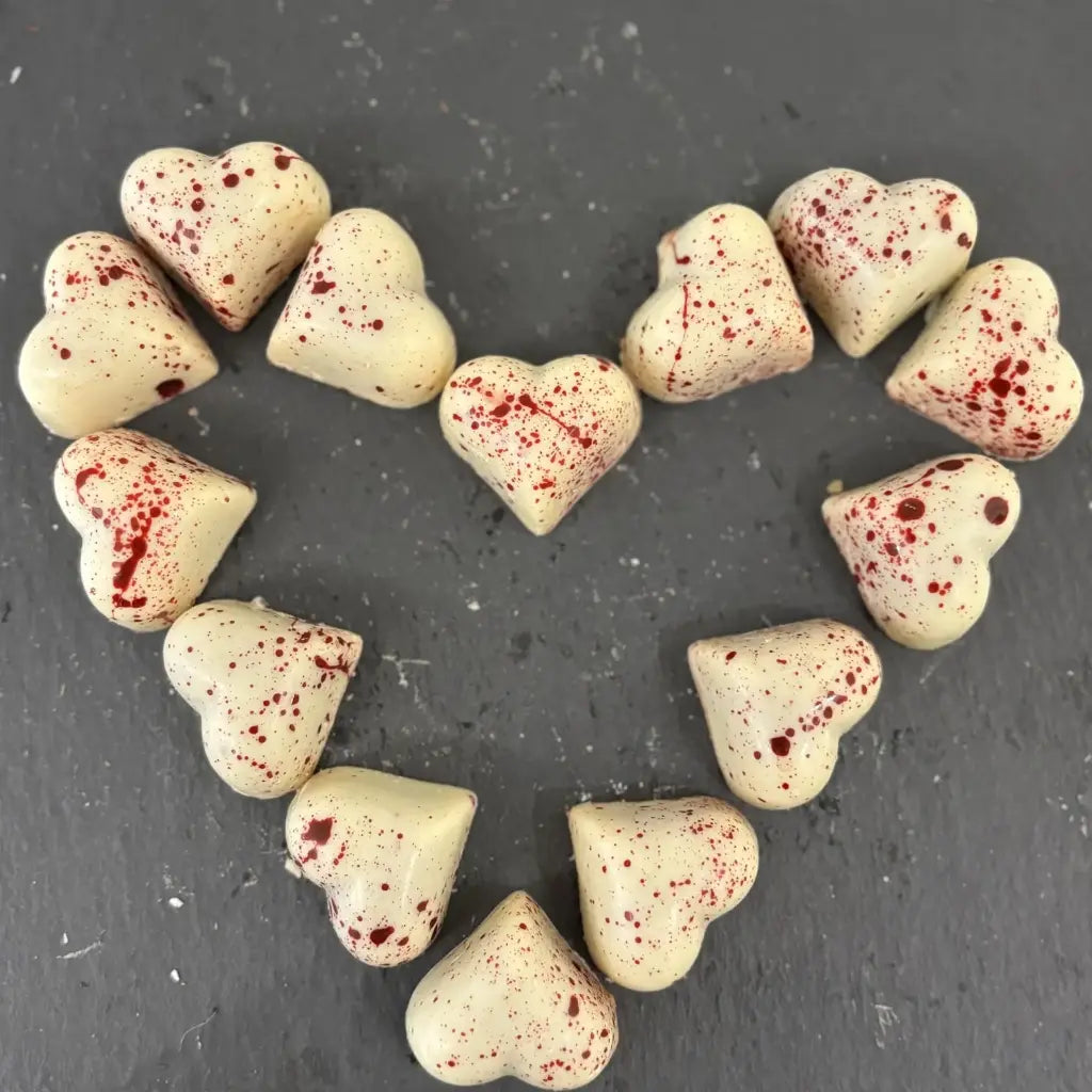 Cœurs chocolat blanc fourrés caramel à la framboise